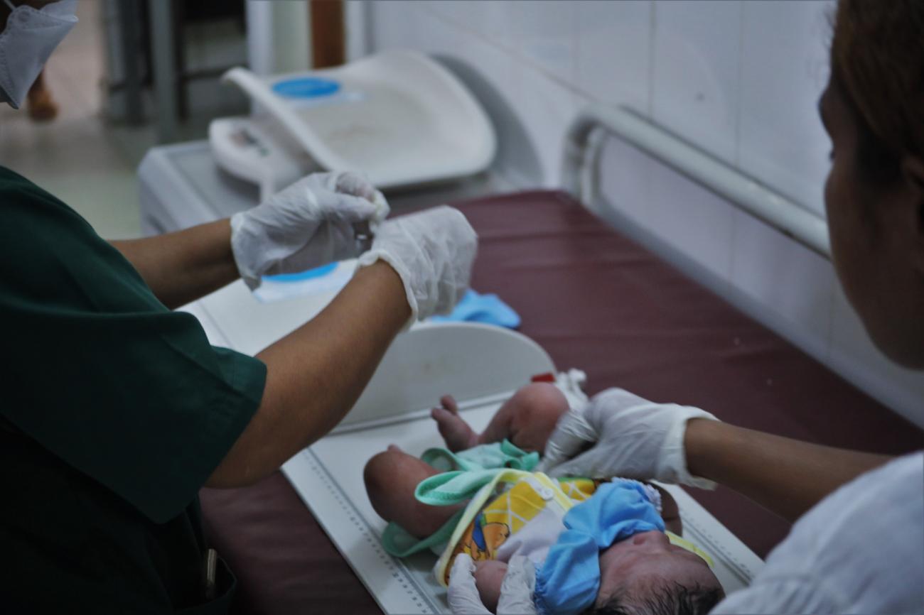 Healthworkers attend to a newborn a few minutes after birth at a community health center in Timor-Leste. 