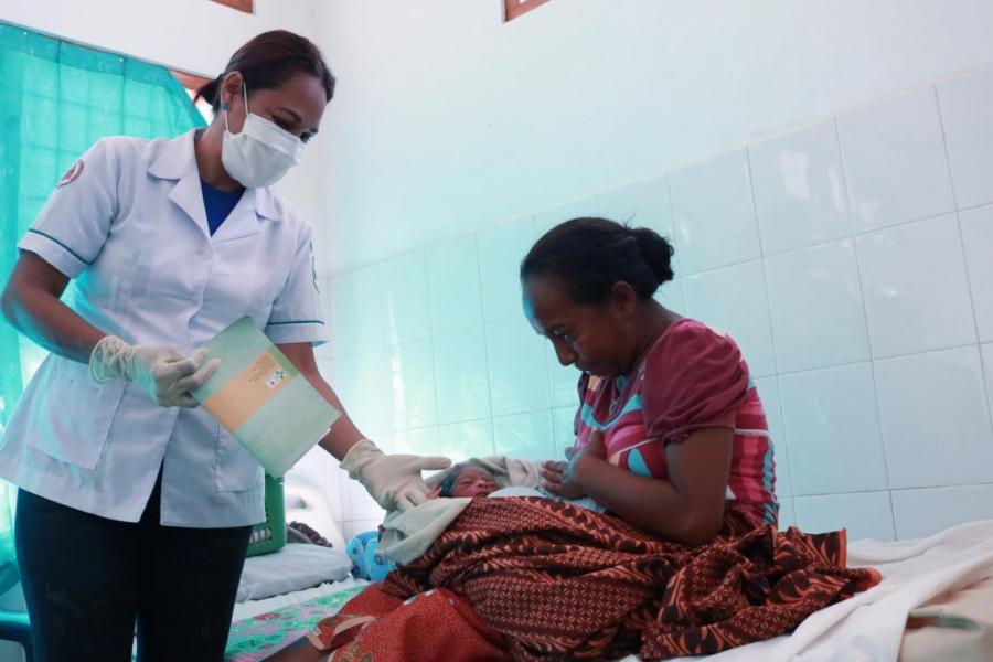 Beatriz attends to a mother and her newborn child at a heath facility in Liquica Municipality.